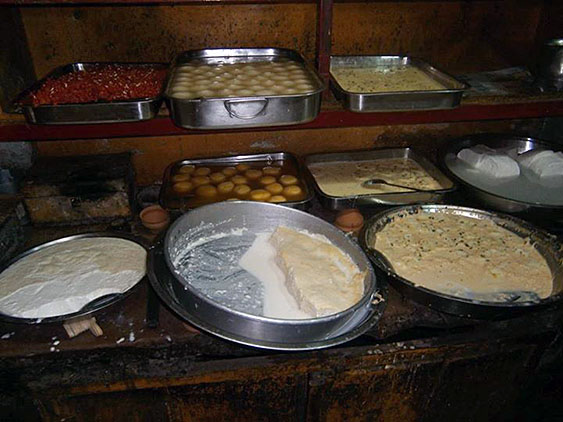 11. Rasgulla - balls of sweet cheese, it has spongy structure. Milk cream - sweetened and not sweetened